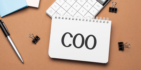 coo on notepad with pen, glasses and calculator - obrazy, fototapety, plakaty