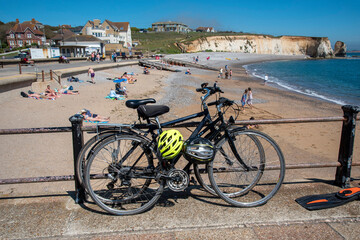 Freshwater Bay, Isle of Wight, UK. 2021.  Cycles locked to the seawall barrier above the beach at...