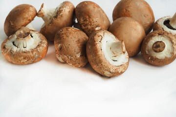 Edible mushrooms, champignons on a white background. High quality photo