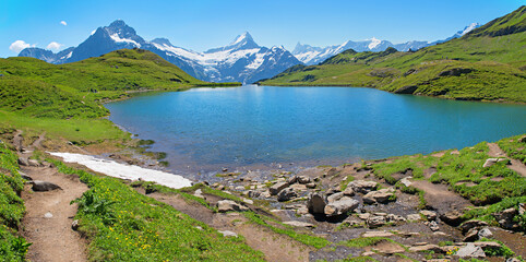 idyllic alpine lake Bachalpsee, hiking destination from Grindelwald First, swiss alps © SusaZoom