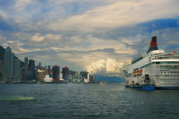 Hong Kong, China.  Cloudy sundown and typhoon inception over Victoria Harbor.