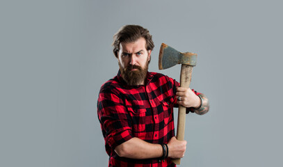 Grooming of real man. handsome hipster with axe. logger or axeman concept