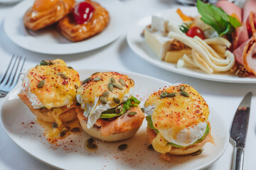 sandwich with salmon and  poached egg
