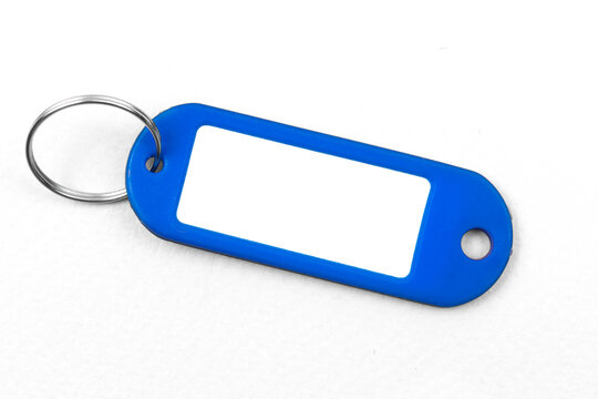 Blank Blue Name Badge Mockup Design, Plastic Mamecard With Key Ring On A White Background, Copy Space Photo