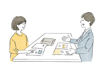 営業カウンターで説明する男性