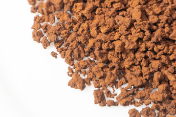 Instant coffee powder on white background with selective focus
