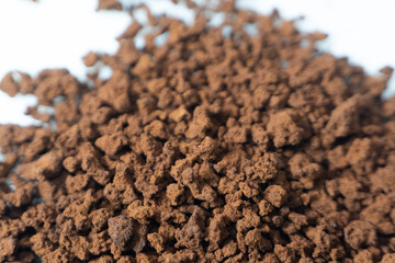 Instant coffee powder on white background with selective focus