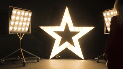 A woman actress on the catwalk to showcase her acting talents.