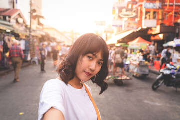 Asian young woman selfie on Khao San Road in Bangkok, Thailand.