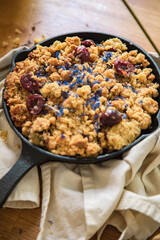 vegan cherry crumble in a skillet