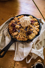 vegan cherry crumble in a skillet