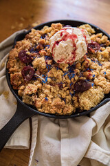 vegan cherry crumble in a skillet