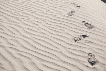Fototapeta na wymiar sand texture with footprint