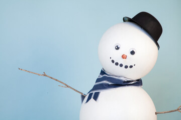 Snowman on blue background photo studio setup