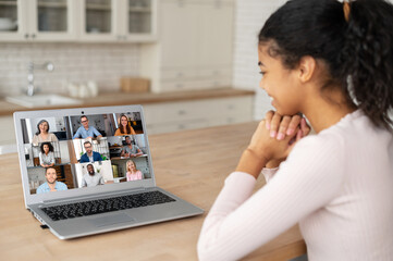 African American female businesswoman using app for distance video communication, meeting online,...