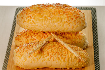 freshly baked Parmesan bread on a wooden surface