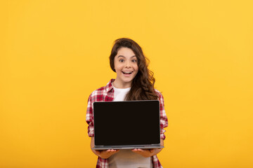 Naklejka premium amazed smart child presenting laptop at school online lesson, school presentation