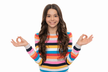 Happy girl child meditate using energizing yoga Gyan mudra isolated on white, meditation
