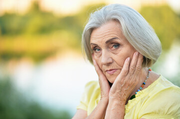 Naklejka premium sad senior beautiful woman
