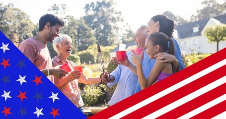 American flag design against caucasian family having a barbecue in the garden