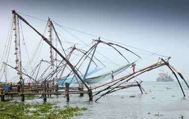 An Ancient traditional method of fish catching in Kerala state,  popularly called as the Chinese fishing nets where natives have made this as a means of Livelihood in India.