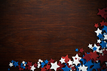 4th of July American Independence Day stars decorations on wooden background. Flat lay, top view.