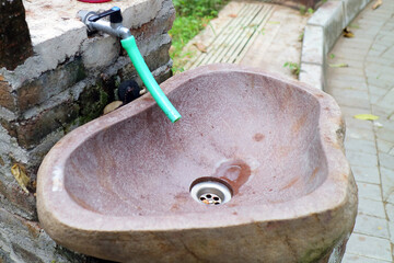 brown sink made of stone