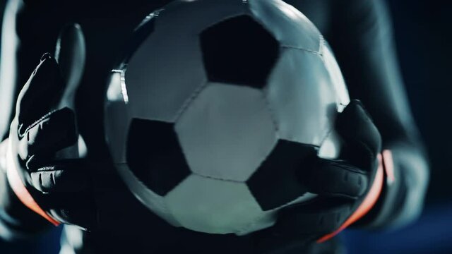 Professional Anonymous Soccer Goalkeeper Holding Fooltabll Ball. Star Footballer Goalie Accepting the Challenge, Determined, Confident in Winning Championship. Dramatic, Stylsih, Cinematic. Close-up - Powered by Adobe