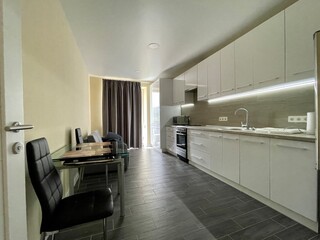 white kitchen and black floor