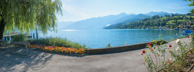 lakeside promenade tourist destination Faulensee, lake Thunersee switzerland