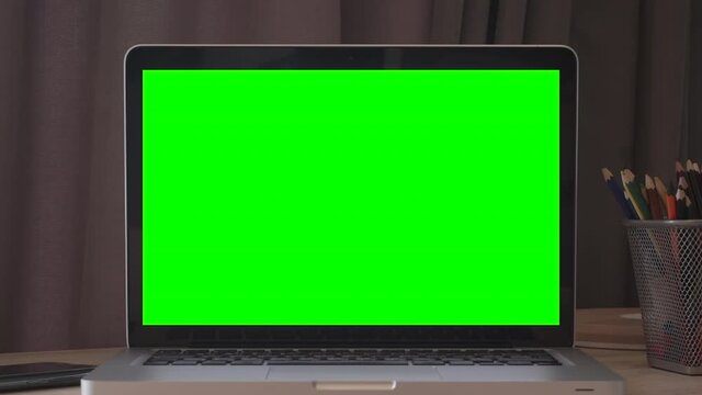 Laptop mockup screen background. Empty computer screen on desktop in the interior of a home room or business office