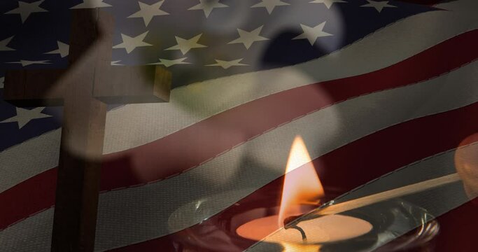 Animation of crucifix and candle moving over american flag