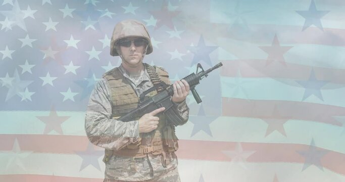 Animation of male soldier holding machine gun moving over american flag