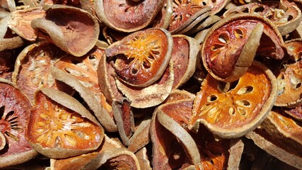 Dried bael fruit background. Close up dried herb. Many of slices of bael fruit .