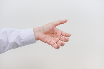 A asian business man's left hand with action on white background with copyspace
