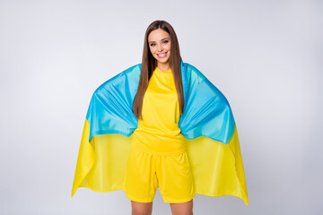 Portrait of her she nice beautiful pretty lovely cheerful straight-haired girl fan covered in Ukrainian flag trip country isolated over light white gray pastel color background