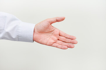 A asian business man's left hand with action on white background with copyspace