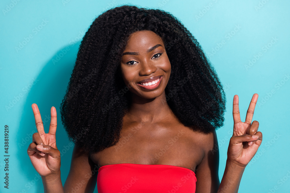 Sticker photo of happy positive charming young woman good mood hold v-sign isolated on teal color background