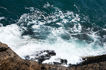 Rocky shore. Tidal bore. Ocean shore.