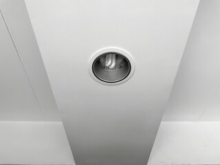 Compact-fluorescent (CFL) bulbs installed on the white ceiling.
