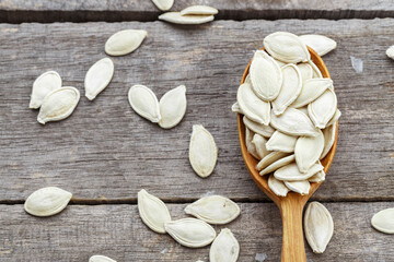 Pumpkin seeds in a wooden spoon