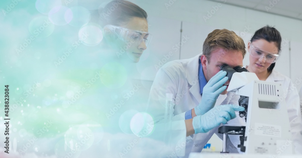 Aufkleber composition of male scientist using microscope in laboratory with copy space