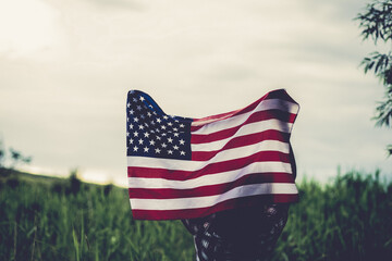 woman holding US flag independence day