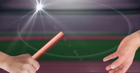 Composition of caucasian athletes passing orange relay baton with glowing light