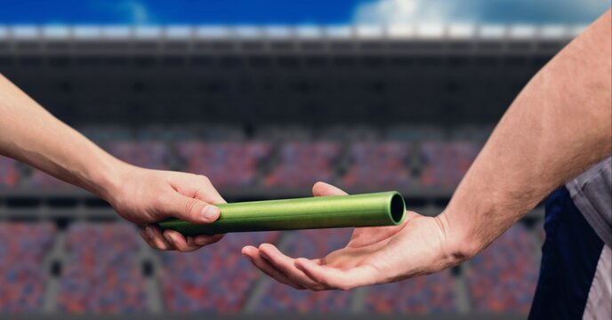 Composition of caucasian athletes passing green relay baton over sports stadium