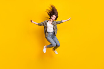 Fototapeta na wymiar Full body portrait of glad cheerful young girl open mouth look camera isolated on yellow color background
