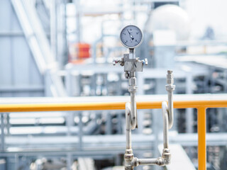Pressure gauge of measuring instrument close up in industry zone at power plant with closed up