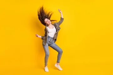 Abwaschbare Fototapete Full length body size view of attractive cheerful dreamy girl dancing having fun isolated over bright yellow color background © deagreez