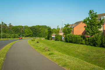 Empty pedestrian way over row of new built houses in england uk