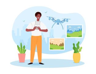 Young male quadcopter operator is making photos with flying drone